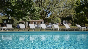 Seasonal outdoor pool, a heated pool, pool loungers