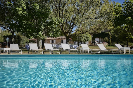 Seasonal outdoor pool, a heated pool, sun loungers