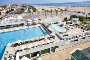 Indoor pool, seasonal outdoor pool, pool umbrellas, pool loungers