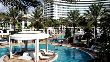 3 outdoor pools, open 7 AM to 7 PM, pool umbrellas, sun loungers