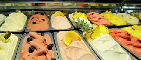 A variety of ice cream flavors in a display case.