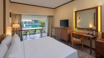 Deluxe Room, Multiple Beds, Garden View | Minibar, in-room safe, desk, blackout drapes