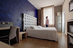 Economy Room | Minibar, in-room safe, individually decorated, desk - Biocity (Milan)
