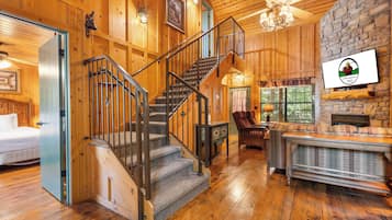 Cabin, 2 Bedrooms, Jetted Tub | Living area | 42-inch LCD TV with cable channels, fireplace