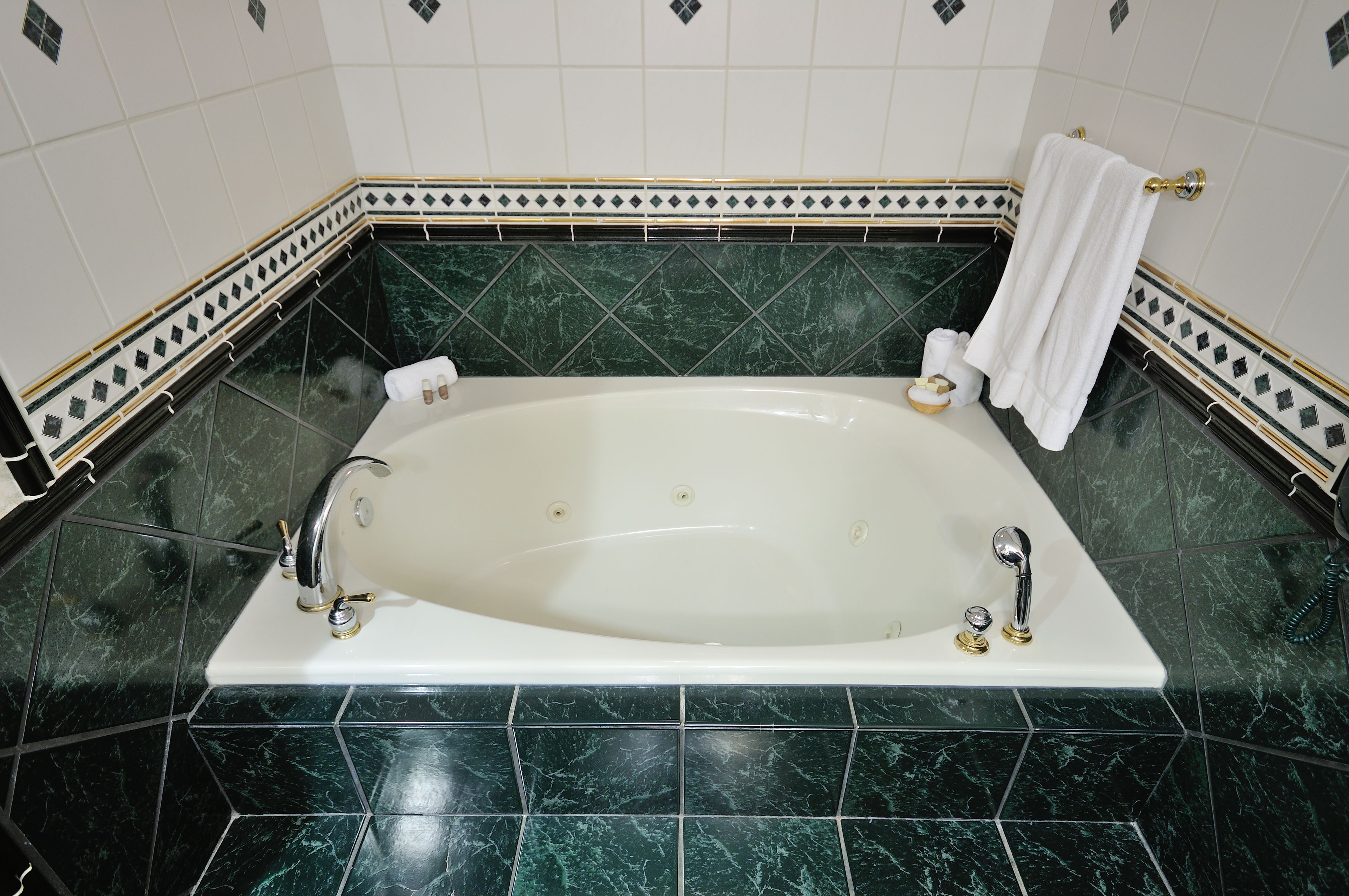 suite, 1 king bed, lake view | bathroom | hair dryer, towels