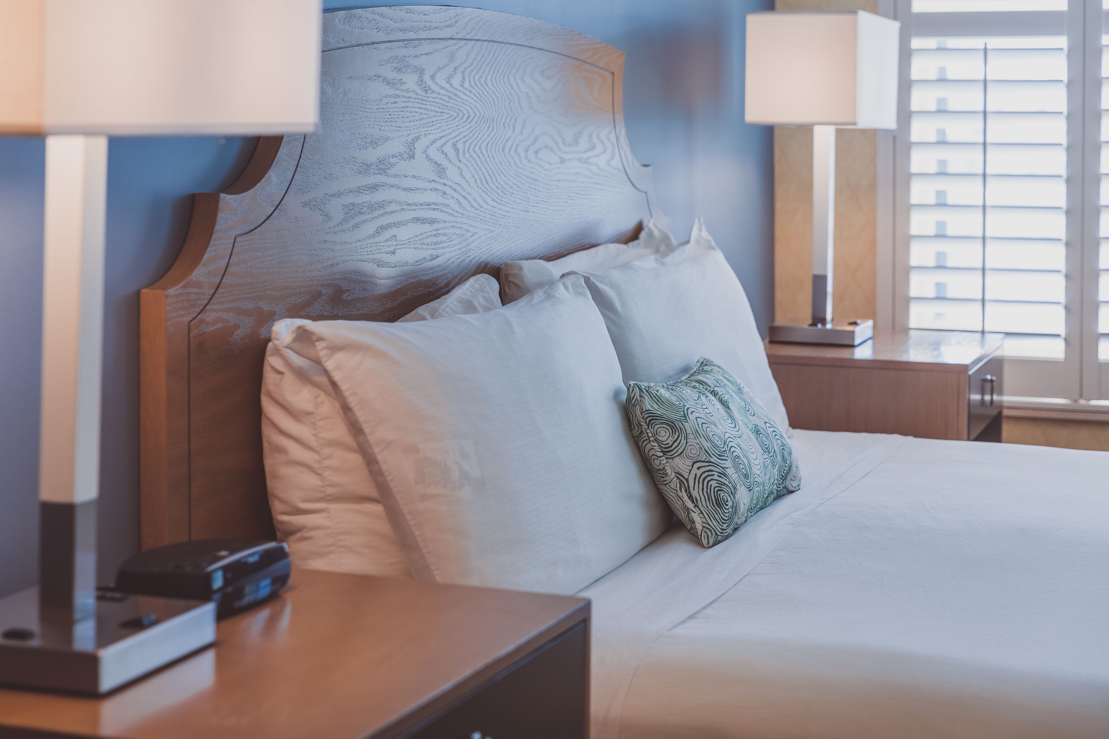 premium bedding, laptop workspace, iron/ironing board