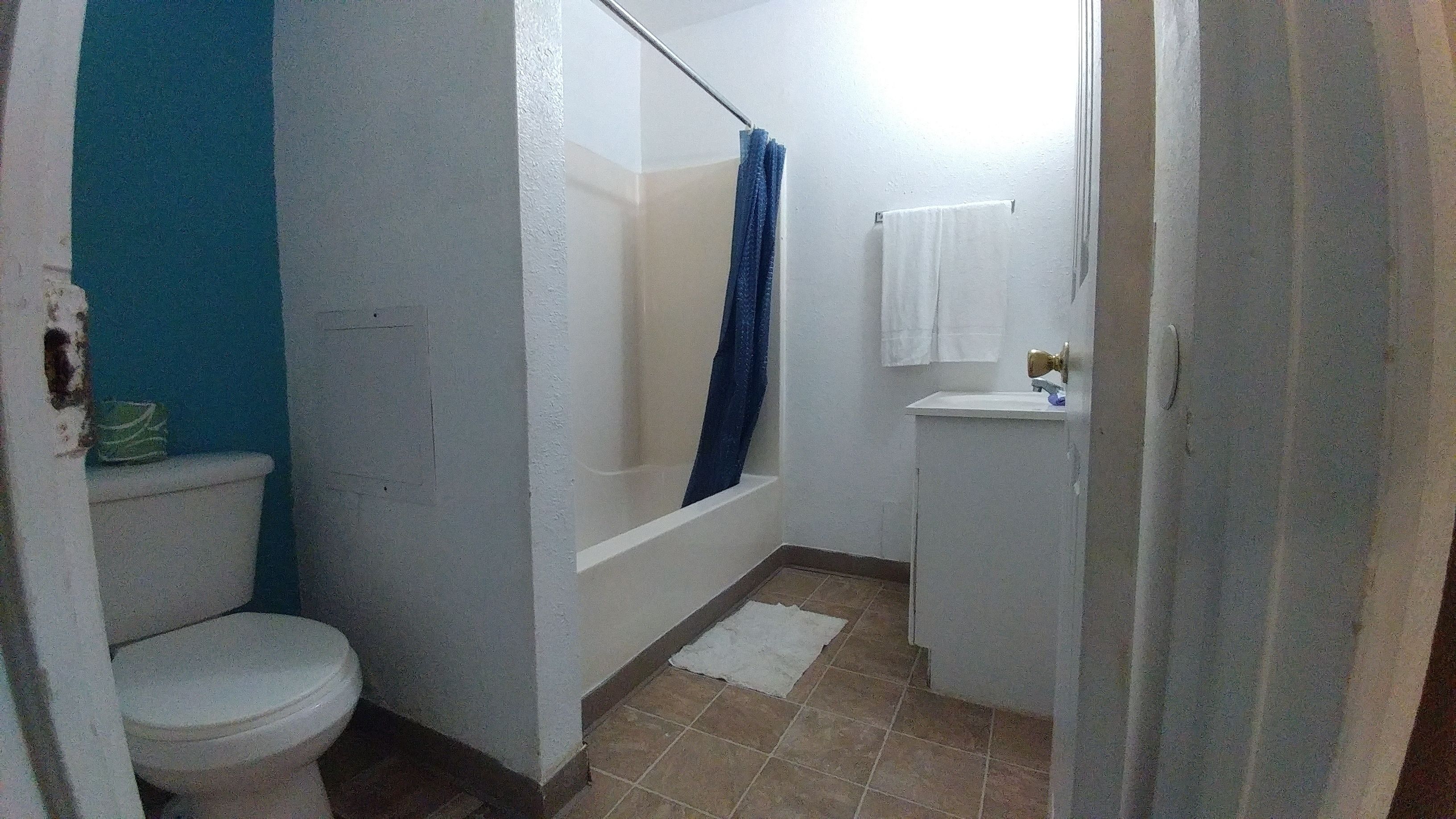 Family Room, 2 Double Beds, Kitchenette | Bathroom | Free toiletries, towels