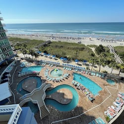 Relax by the pool or enjoy ocean views from a balcony.
