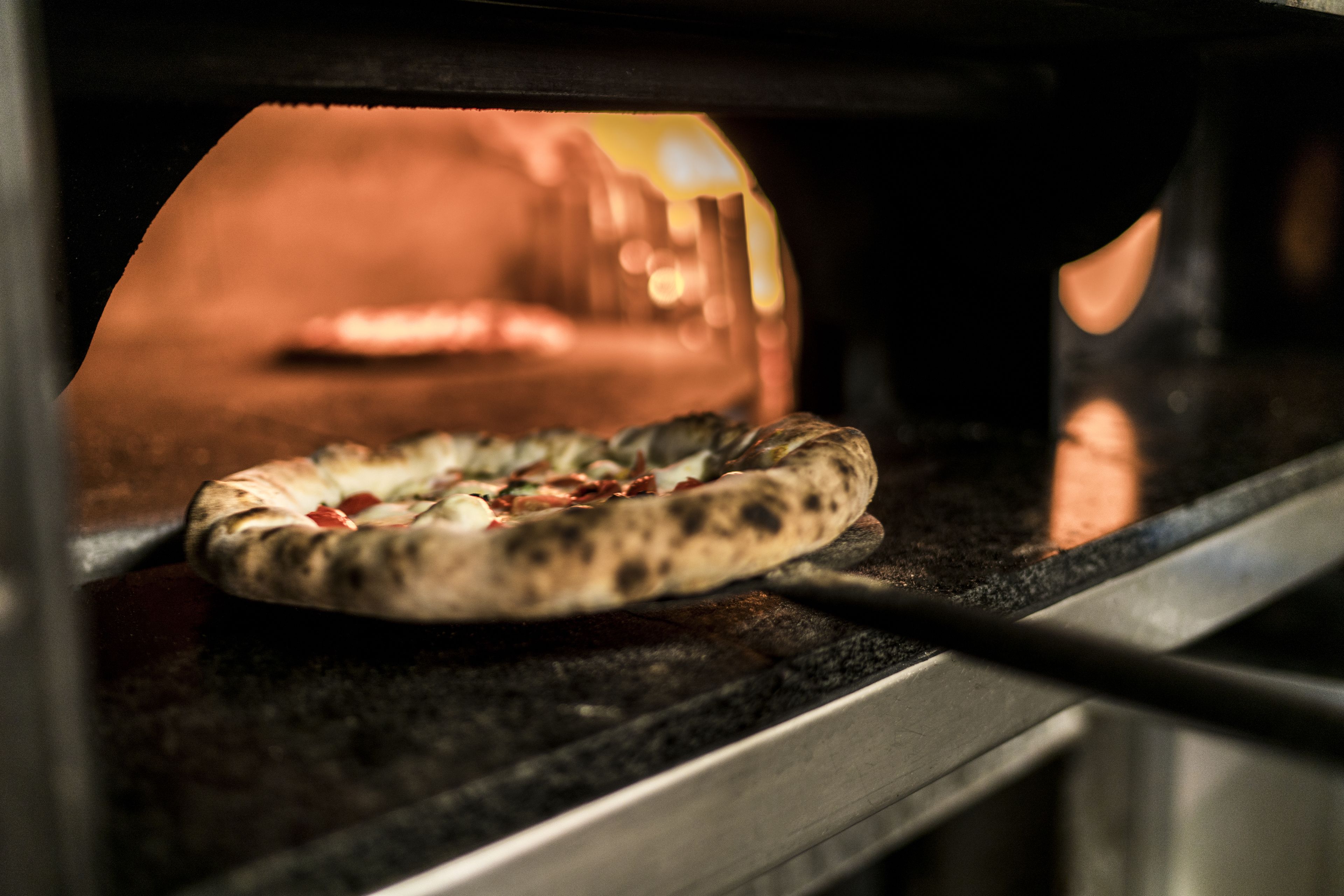 A pizza inside an oven.