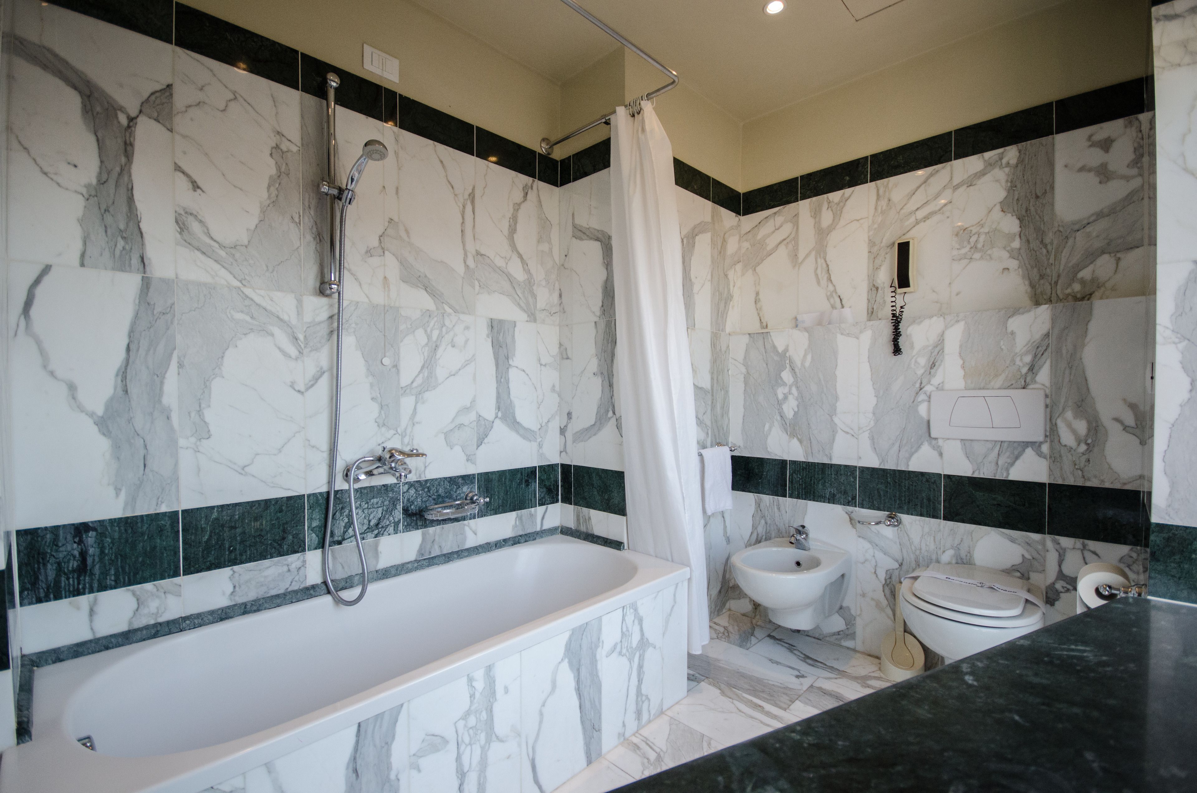 free toiletries, hair dryer, slippers, bidet