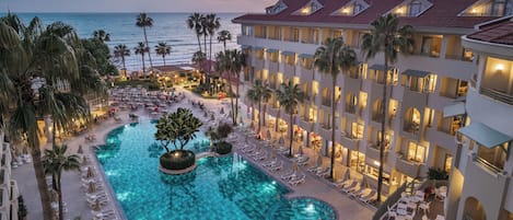 Indoor pool, outdoor pool, pool umbrellas, sun loungers