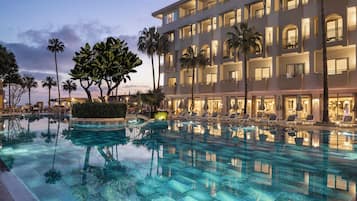 Indoor pool, outdoor pool, pool umbrellas, sun loungers