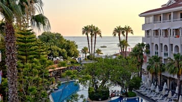 Indoor pool, outdoor pool, pool umbrellas, pool loungers
