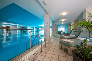 A swimming pool area with a blue ceiling, lounge chairs, and a sign indicating a 1.2m depth. - Royal & Imperial Belvedere Resort - All inclusive (Hersonissos)