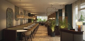 Un restaurant moderne doté d’un long comptoir, de plusieurs tables et de luminaires suspendus.