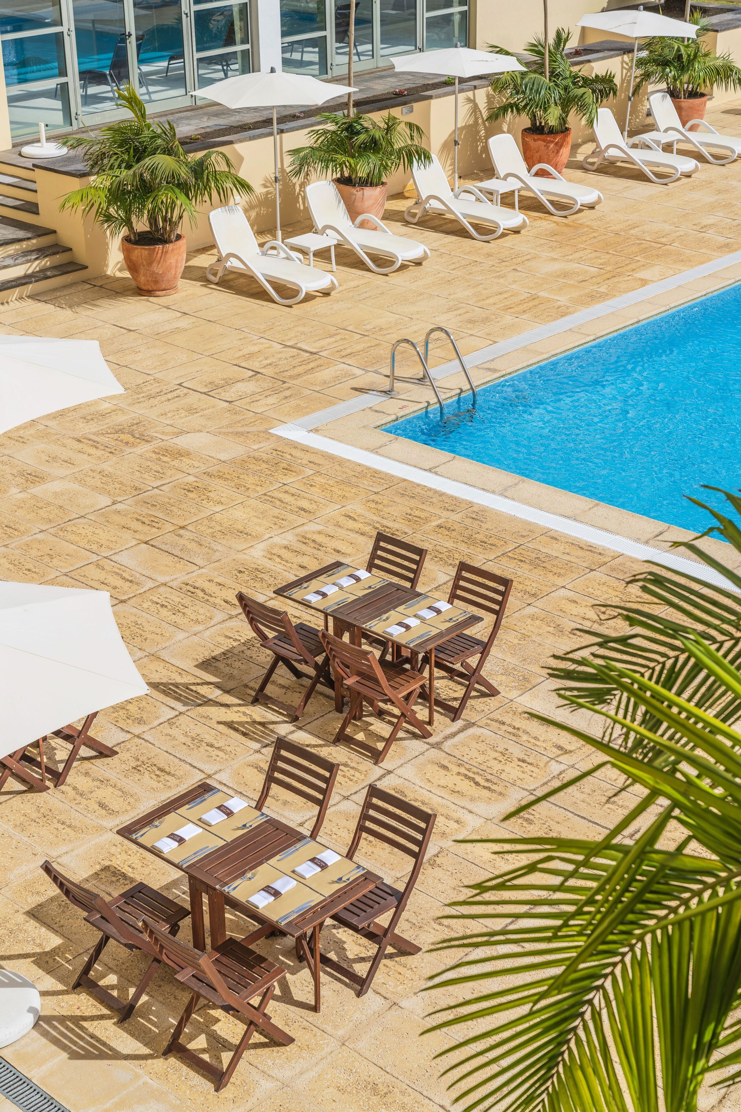 indoor pool, outdoor pool, pool umbrellas, pool loungers