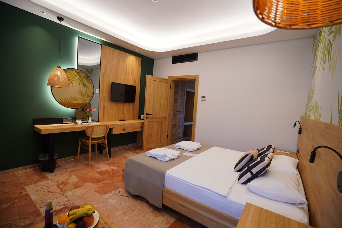 Club Deluxe Family Room | Frigobar, cofres nos quartos, Wi-Fi de cortesia, roupa de cama