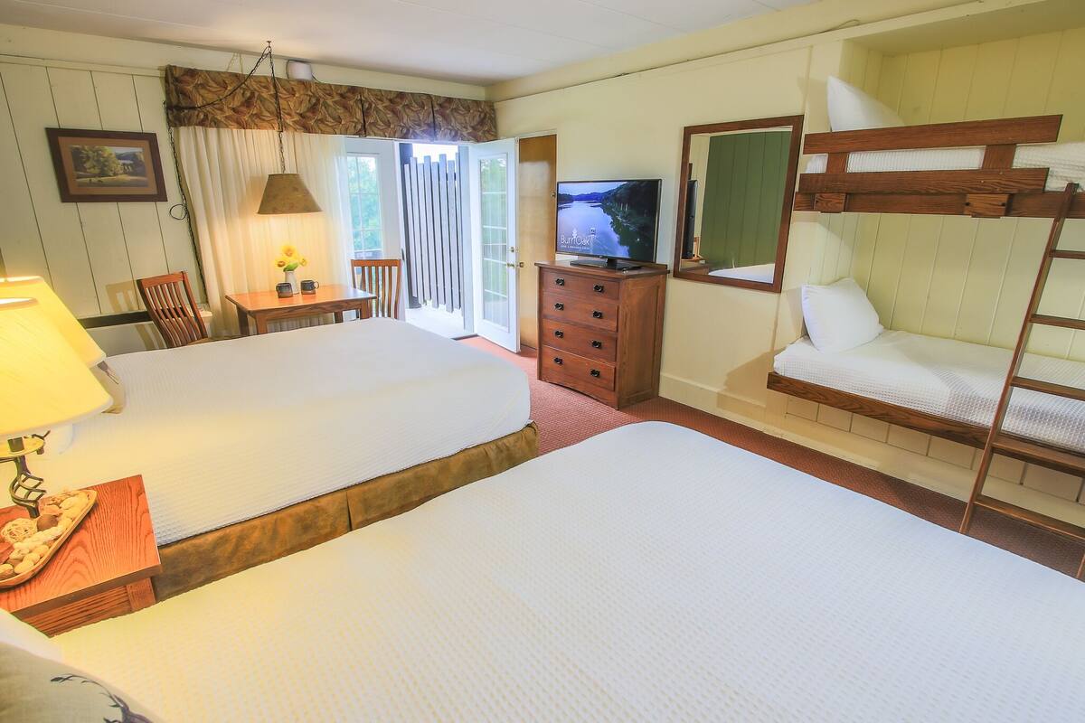 deluxe room, multiple beds (2 queen beds and bunk) | blackout curtains, iron/ironing board, free wifi, bed sheets