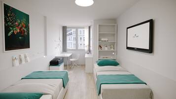 Desk, blackout drapes, iron/ironing board, cribs/infant beds