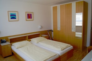 Desk, blackout drapes, iron/ironing board, cribs/infant beds