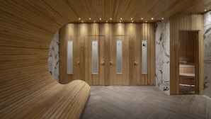 Une salle de bain moderne avec un lambris en bois, des éléments décoratifs en marbre et un banc.