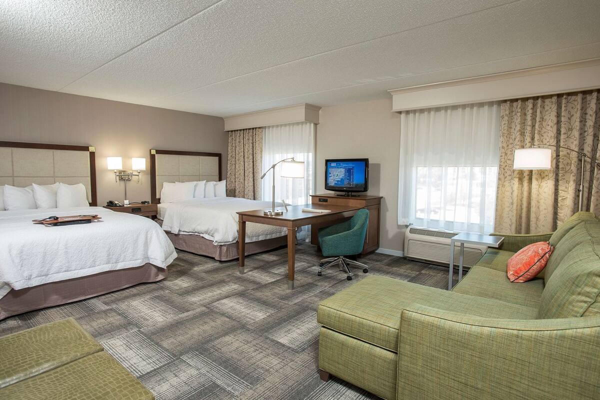 Desk, laptop workspace, iron/ironing board, free cribs/infant beds