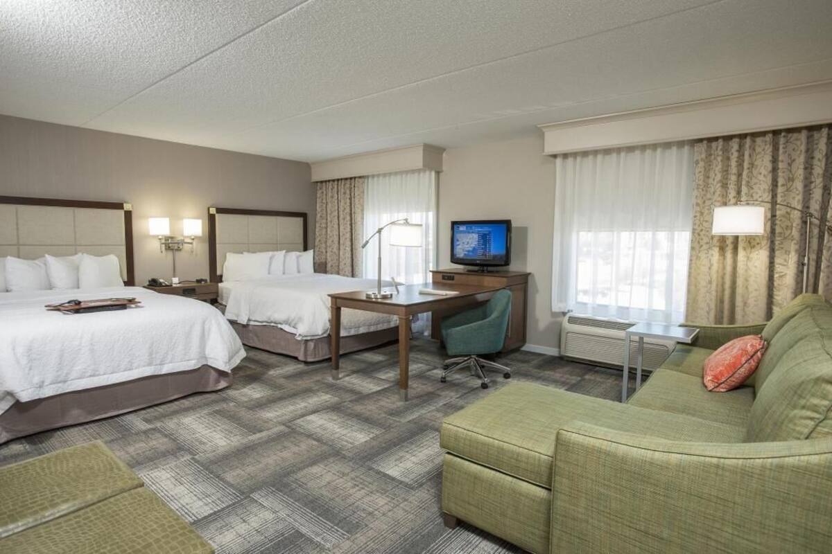 Desk, laptop workspace, iron/ironing board, free cribs/infant beds