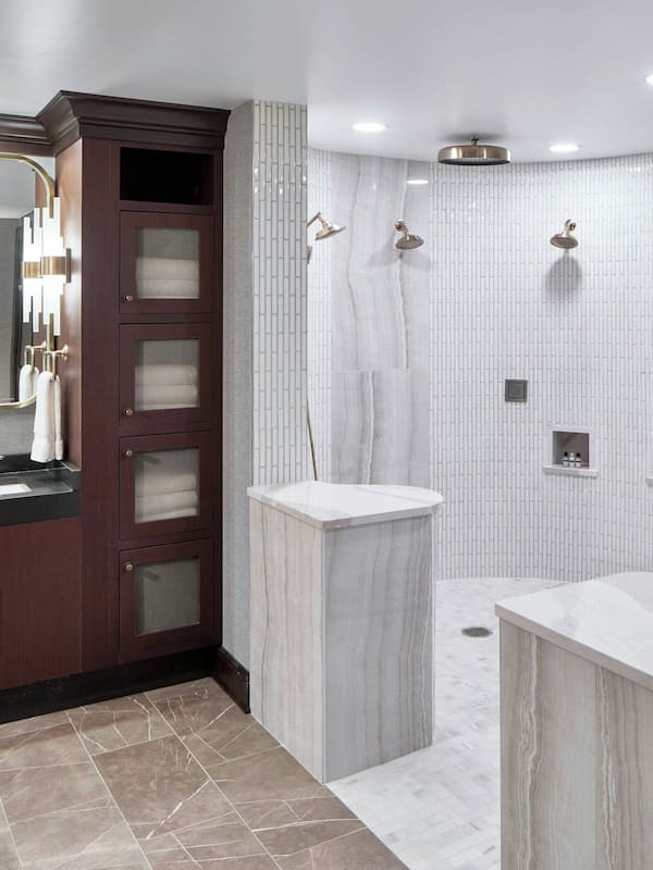 Separate bathtub and shower, designer toiletries, hair dryer, towels