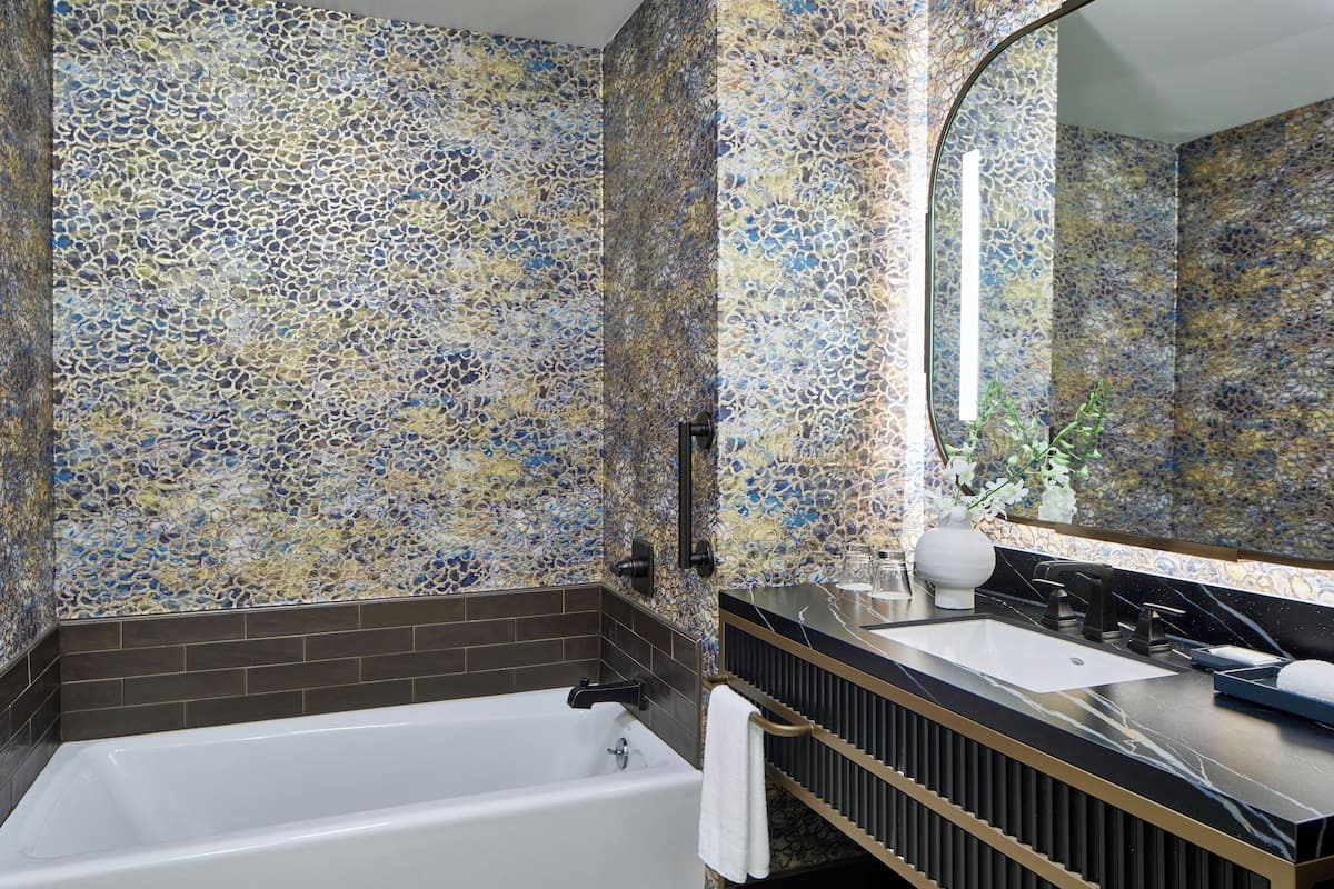 separate bathtub and shower, designer toiletries, hair dryer, towels