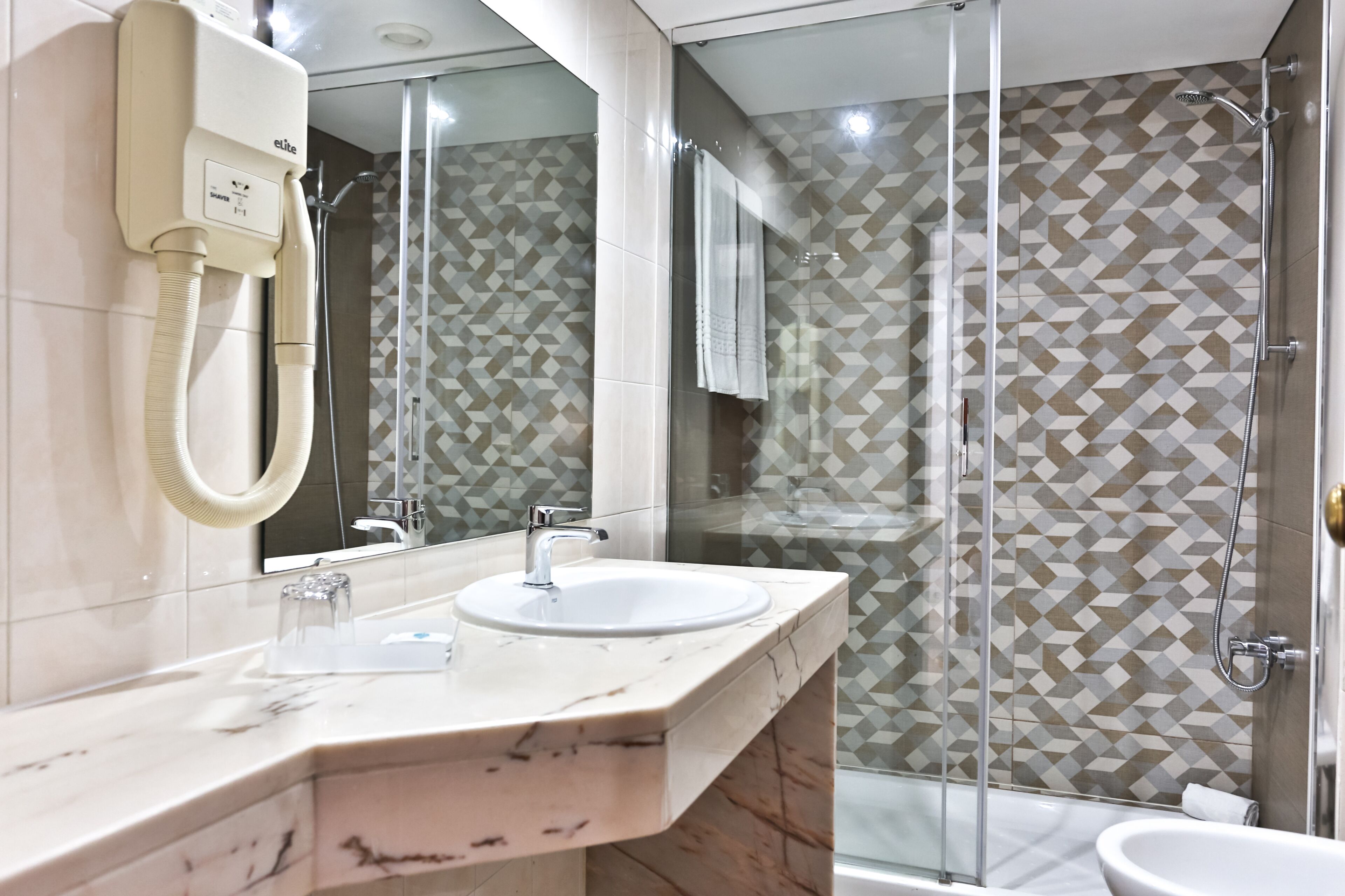 free toiletries, hair dryer, bidet, towels