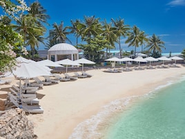 Private beach, white sand, sun loungers, beach umbrellas