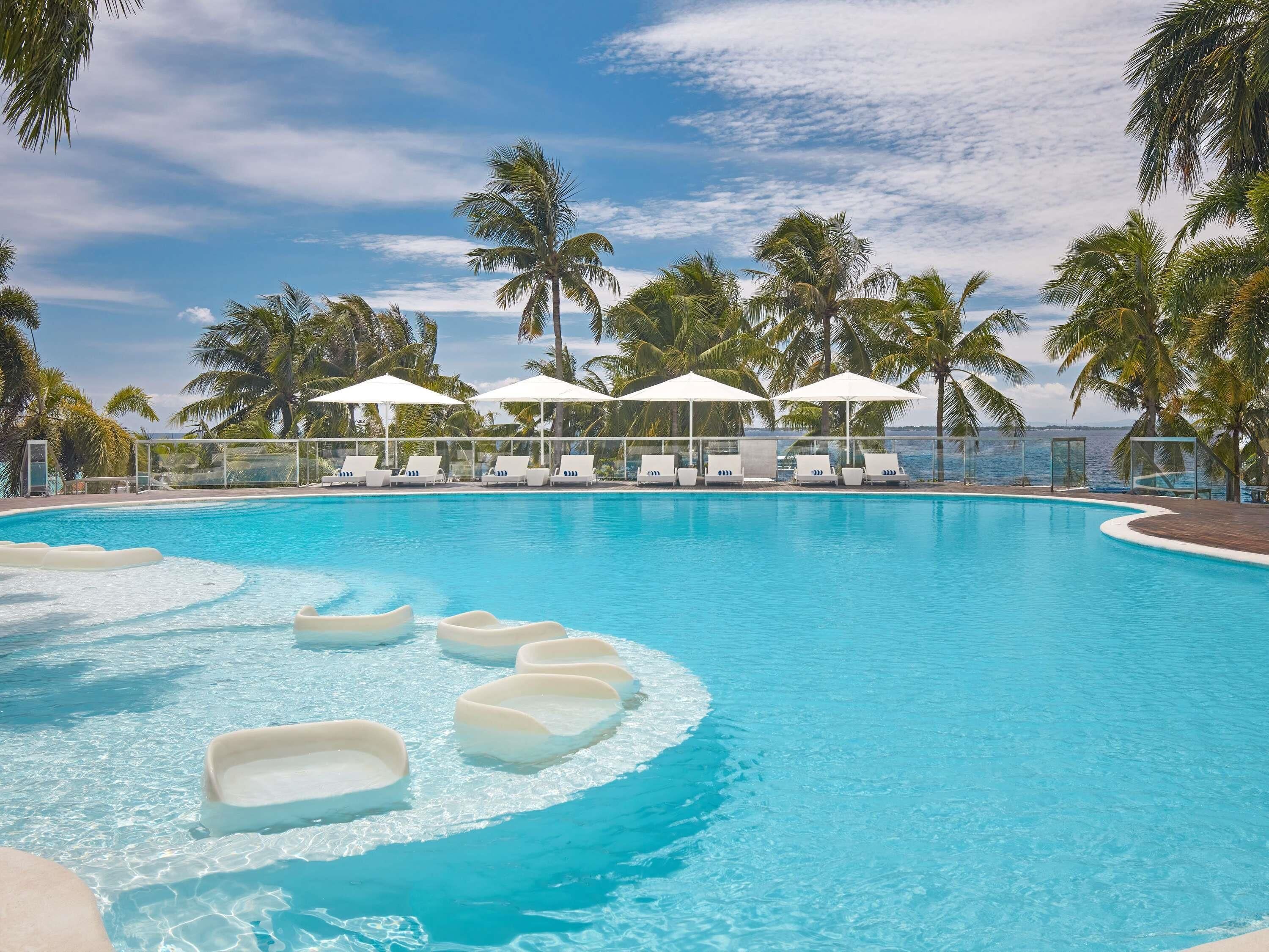 Outdoor pool, pool umbrellas, sun loungers