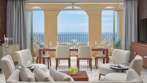 A spacious balcony with a dining table, chairs, and a sofa. - Mövenpick Hotel Mactan Island Cebu (Lapu-Lapu)