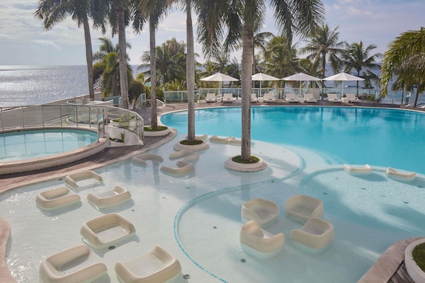 Outdoor pool, pool umbrellas, sun loungers