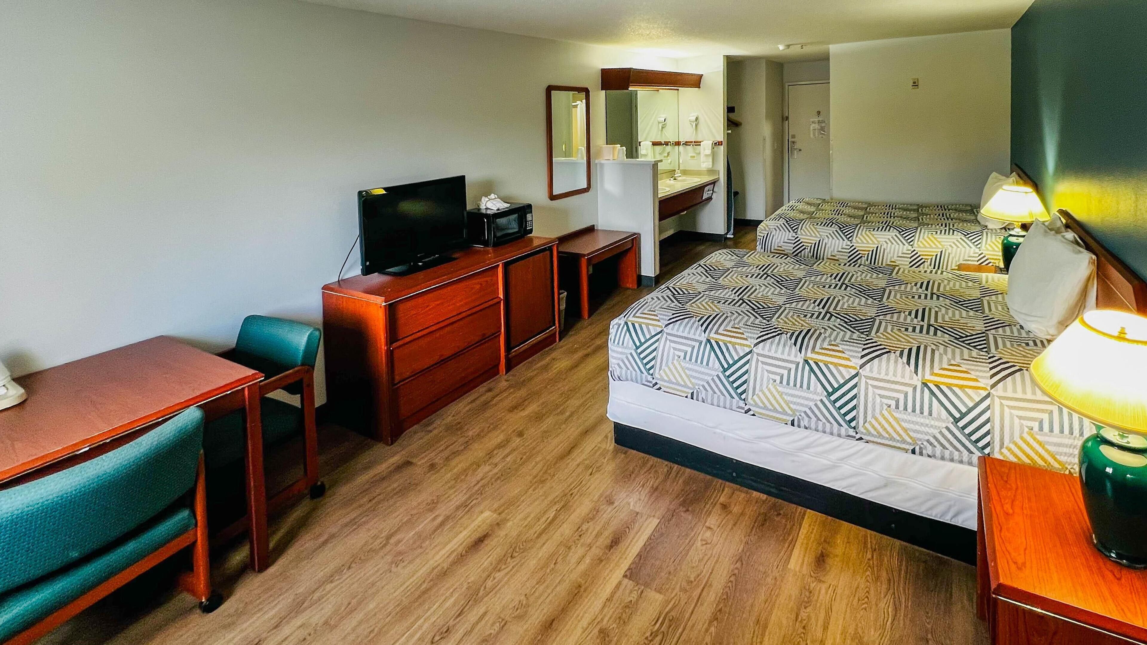 Premium bedding, pillowtop beds, desk, laptop workspace