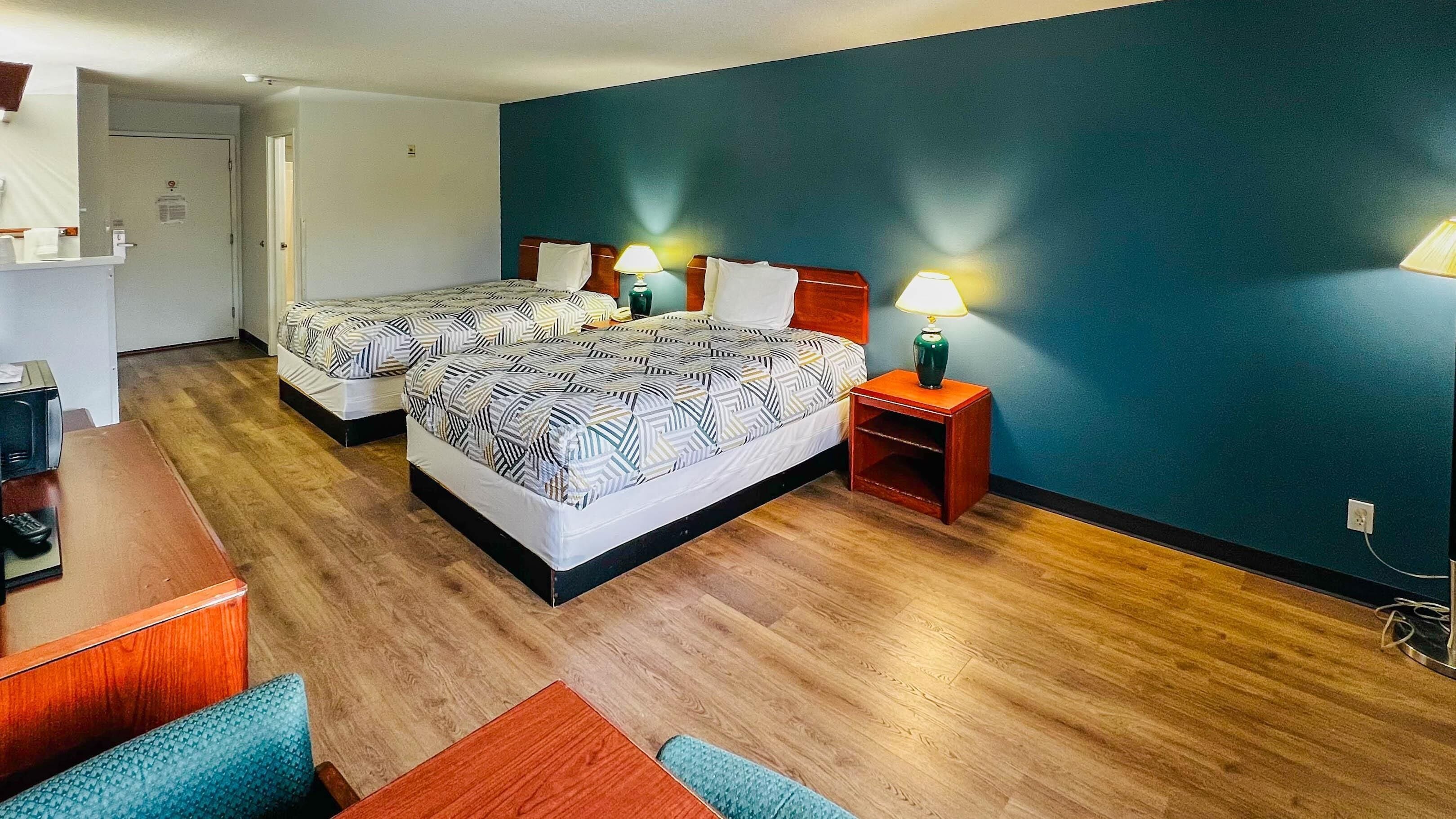 Premium bedding, pillowtop beds, desk, laptop workspace