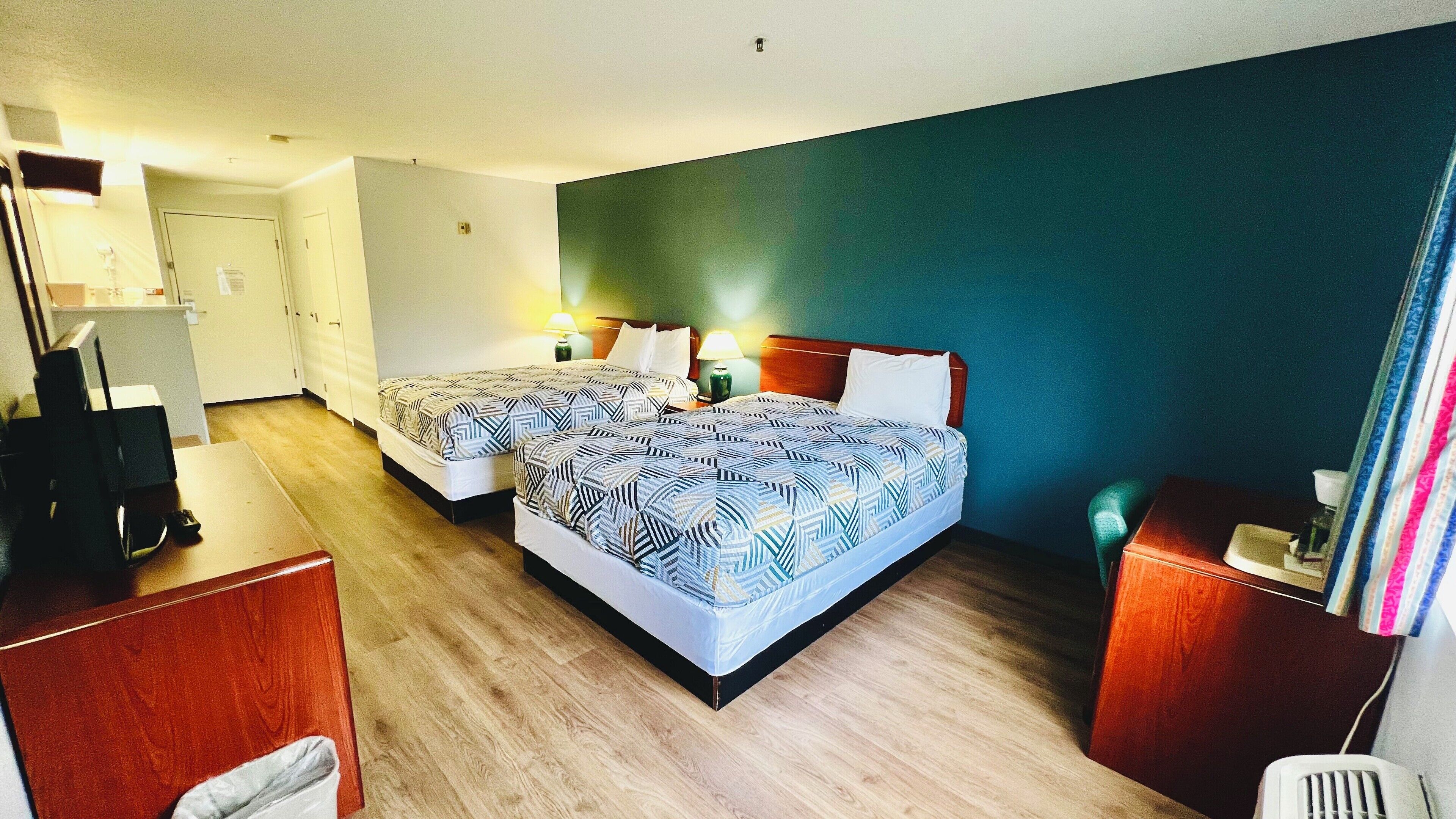 Premium bedding, pillowtop beds, desk, laptop workspace