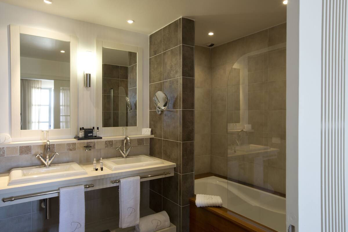 junior suite | bathroom | shower, hair dryer, bathrobes, slippers