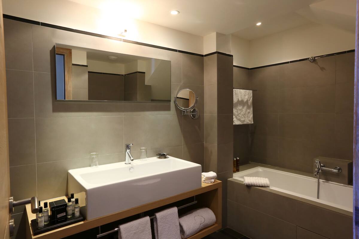 shower, hair dryer, bathrobes, slippers