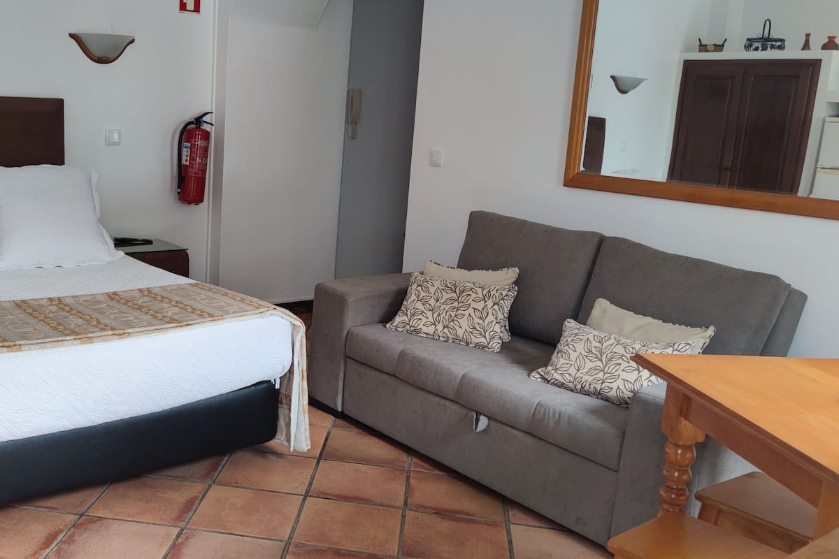 Studio | 1 bedroom, in-room safe, desk, iron/ironing board