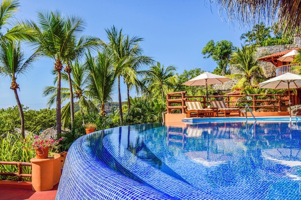 2 outdoor pools, pool umbrellas, pool loungers