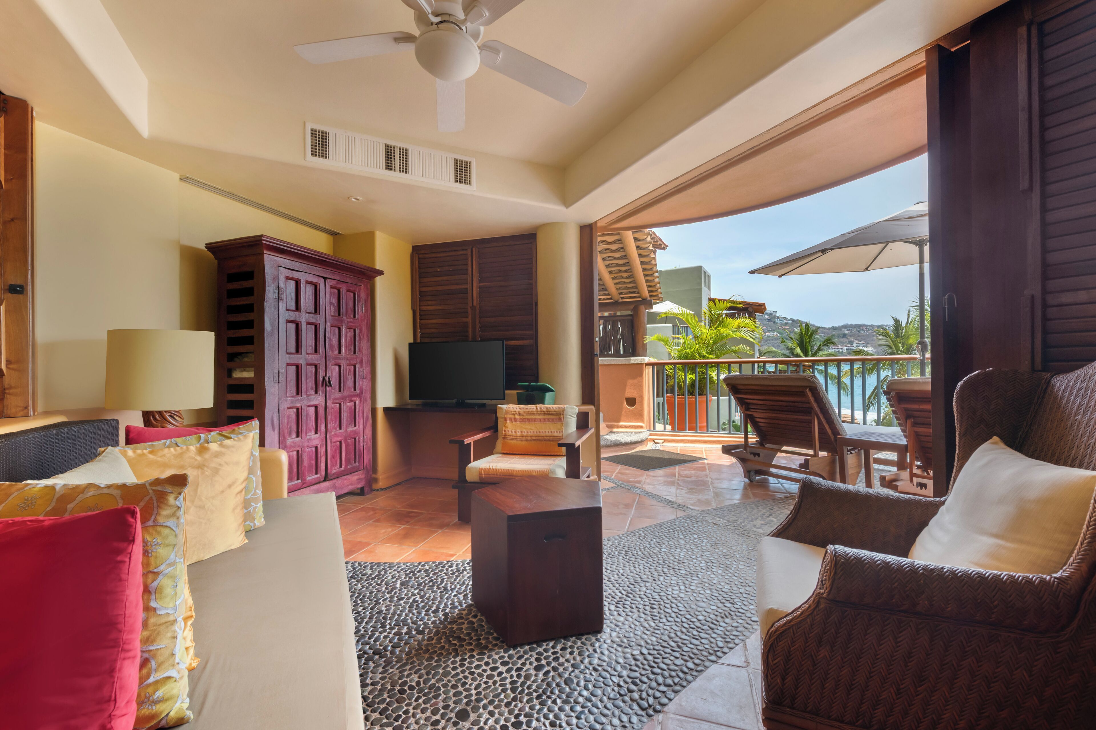 1 bedroom ocean view king with plunge pool | living area | 32-inch tv with satellite channels
