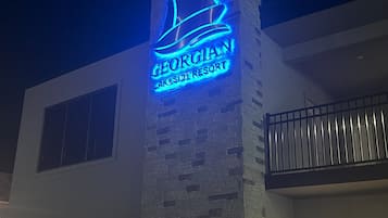 Georgian Lakeside Resort features a modern exterior with a prominent sign and large windows.