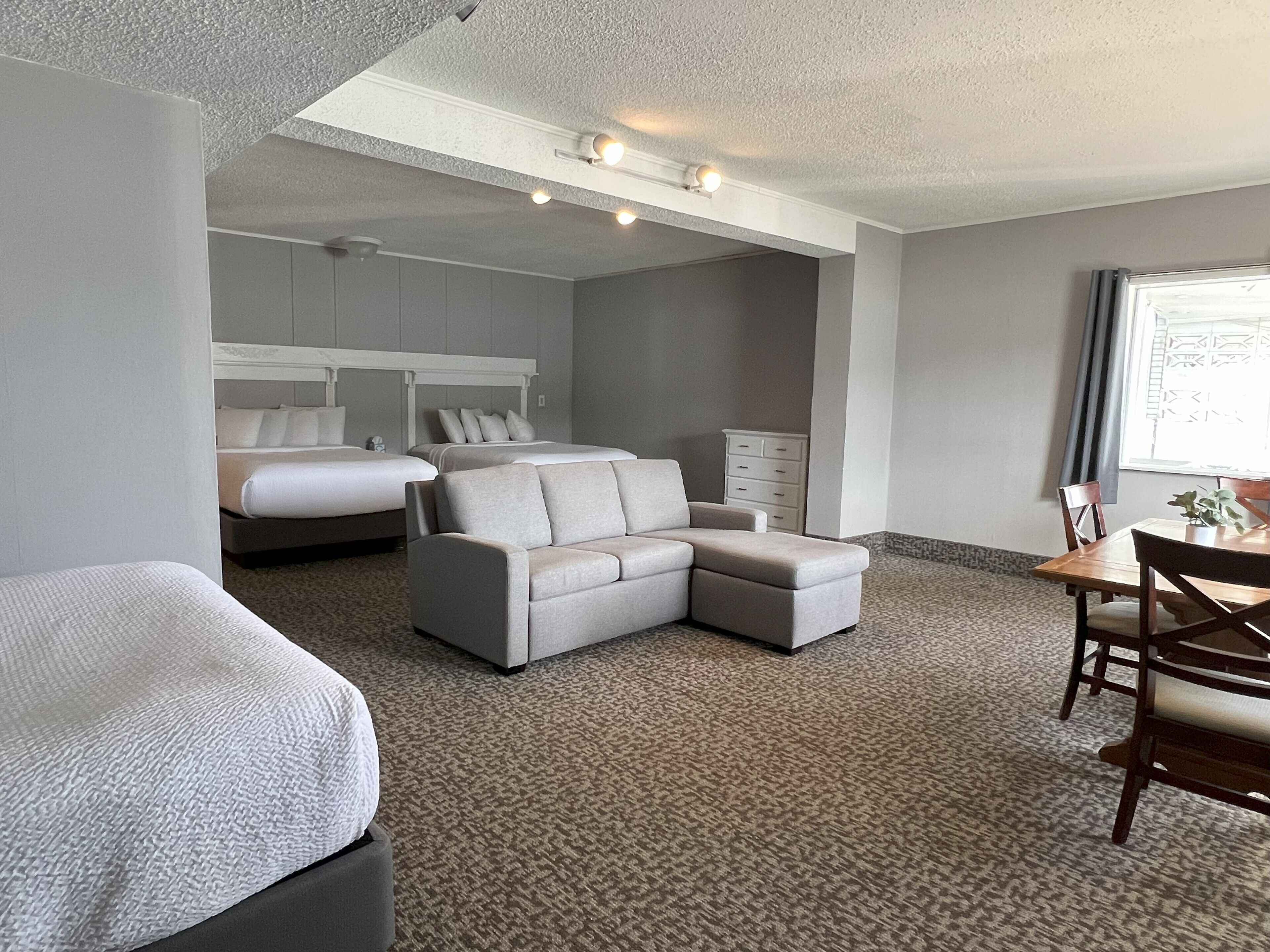 lakefront family suite, 3 queen beds | living area | 37-inch flat-screen tv with cable channels, tv