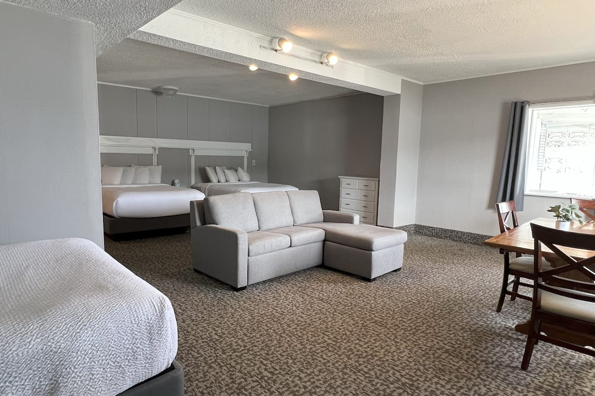 lakefront family suite, 3 queen beds | living area | 37-inch flat-screen tv with cable channels, tv