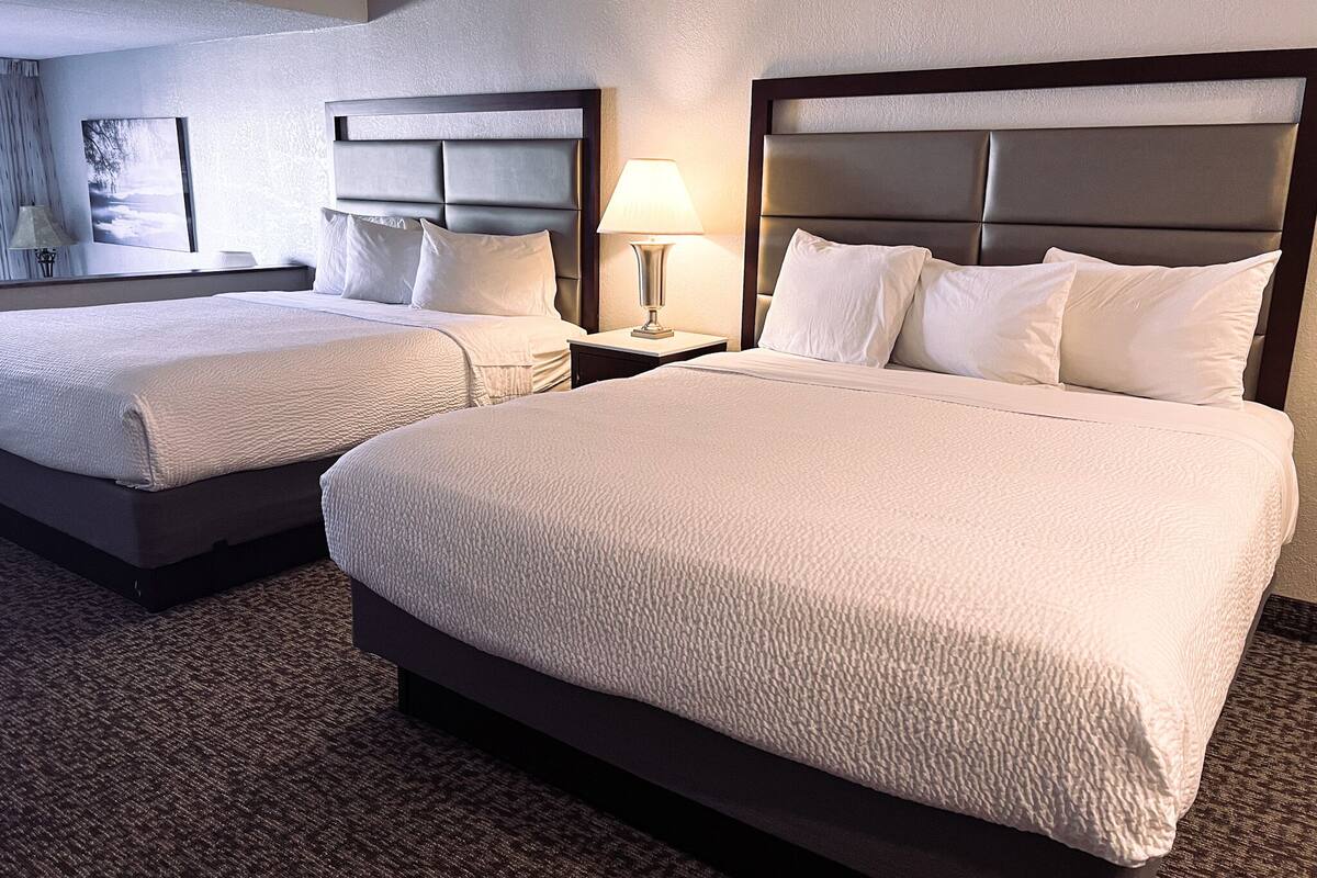 suite, lake view | pillow-top beds, blackout curtains, soundproofing, iron/ironing board