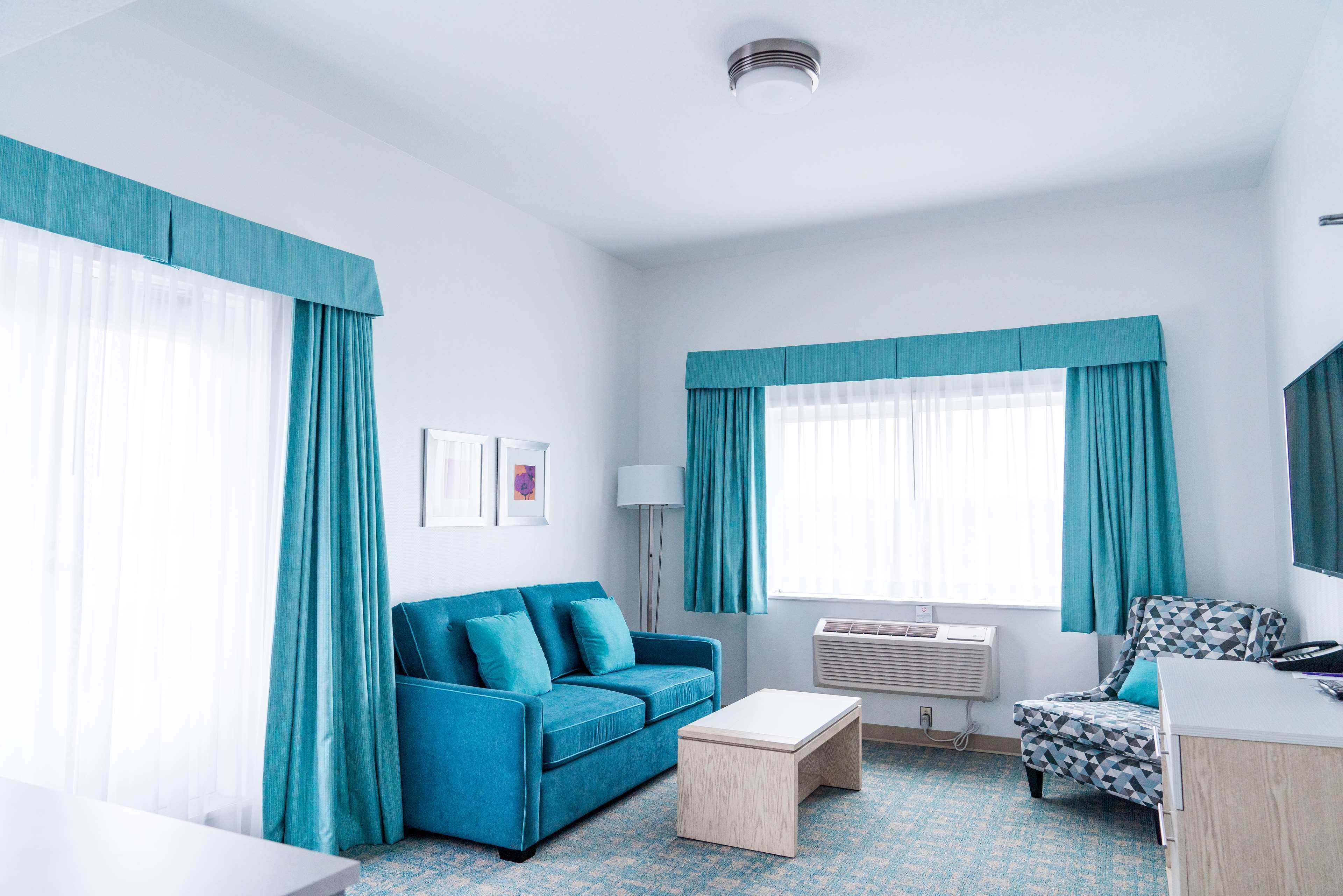 premium bedding, desk, blackout curtains, iron/ironing board