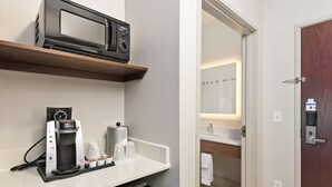 A kitchenette with a coffee maker, microwave, and a small refrigerator. - Holiday Inn Express Hotel & Suites Conroe I-45 North by IHG (Conroe)