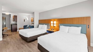 A hotel room with two beds, a desk, a chair, and a kitchenette. - Country Inn & Suites by Radisson, Elizabethtown, KY (Elizabethtown)