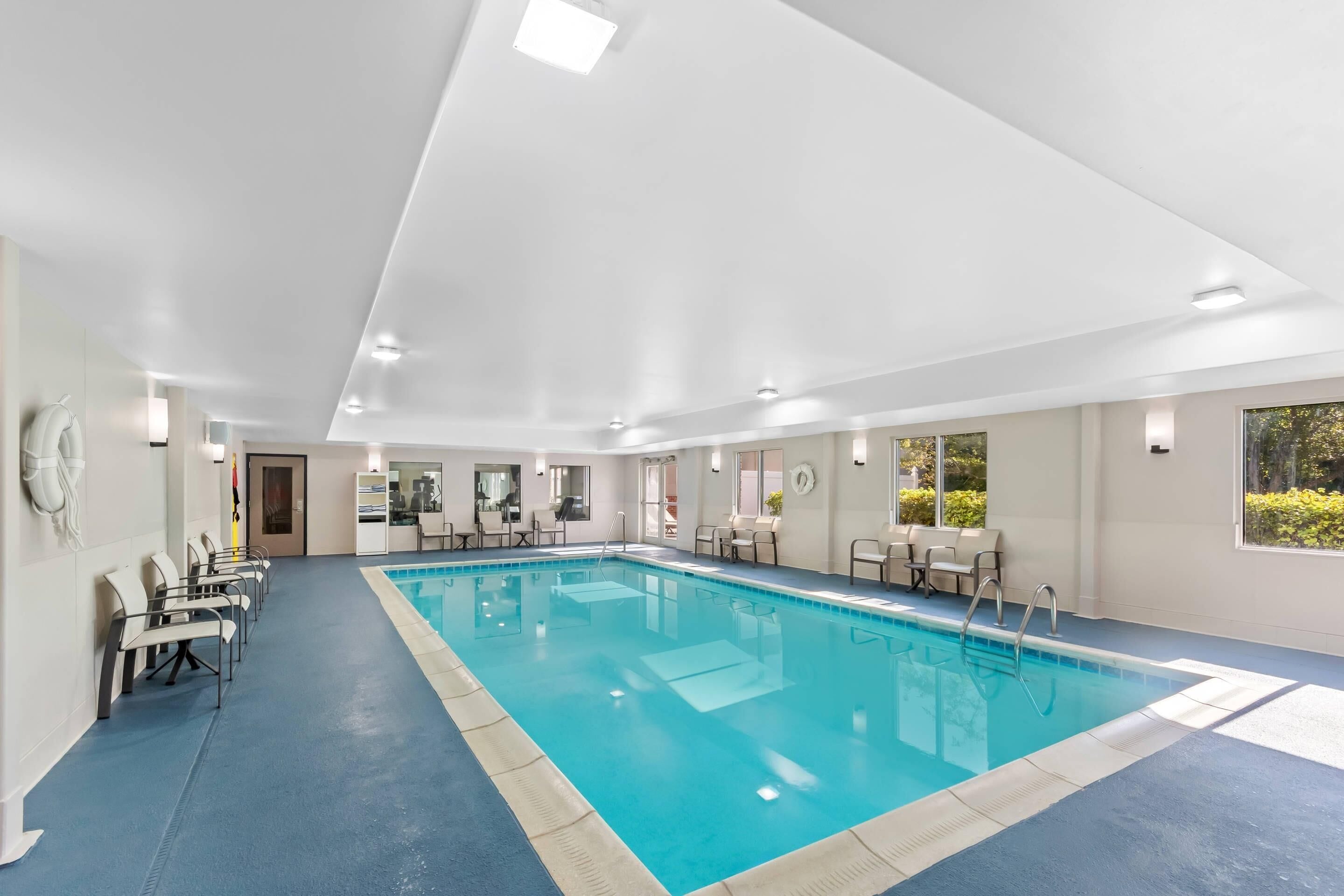 Indoor pool, open 6:00 AM to 11:00 PM, pool loungers